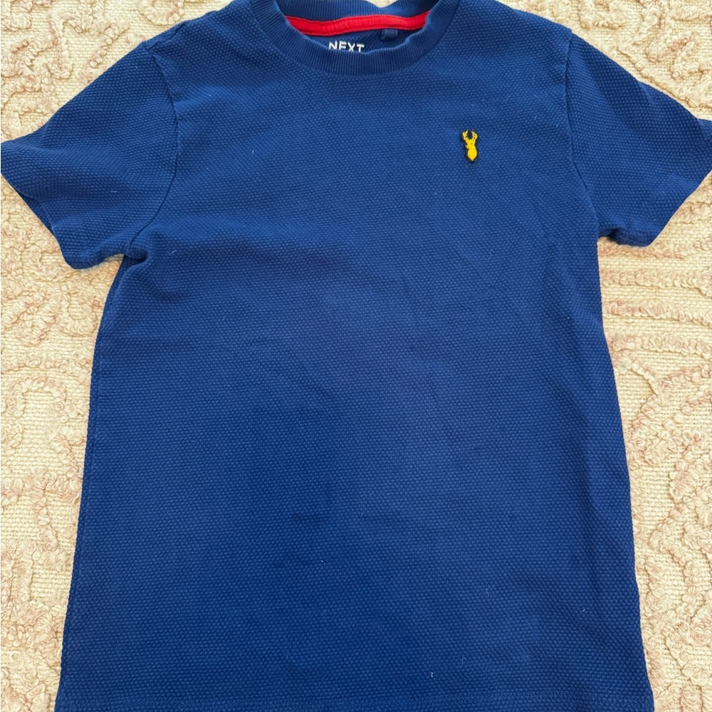 Next Kids Navy Blue Tee with Yellow Next logo. Size 10